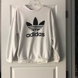 Woman’s white Adidas sweatshirt